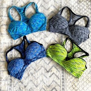 Four PINK sports bras
